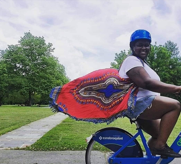 Grant awardee Iresha Picot riding her bike in a park